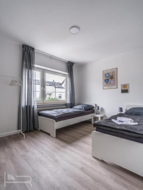 Voll ausgestattete Apartments mit Einzelbetten - Küche - WLAN - PKW-Parkplatz